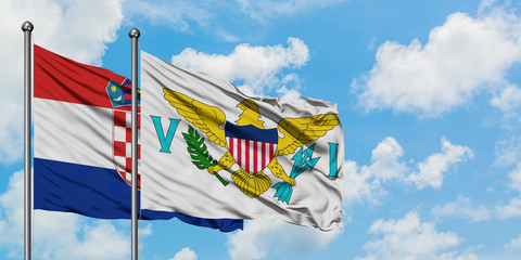 Croatia and United States Virgin Islands flag waving in the wind against white cloudy blue sky together. Diplomacy concept, international relations.