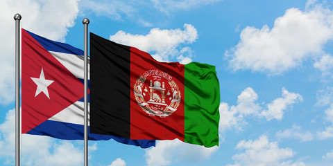 Cuba and Afghanistan flag waving in the wind against white cloudy blue sky together. Diplomacy concept, international relations.