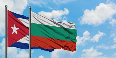 Cuba and Bulgaria flag waving in the wind against white cloudy blue sky together. Diplomacy concept, international relations.