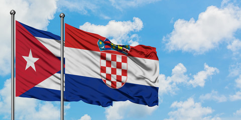 Cuba and Croatia flag waving in the wind against white cloudy blue sky together. Diplomacy concept, international relations.