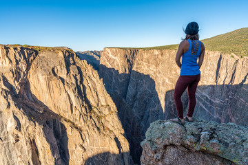 Woman Doing Handstands and Looking over the Black Canyon of the Gunnison