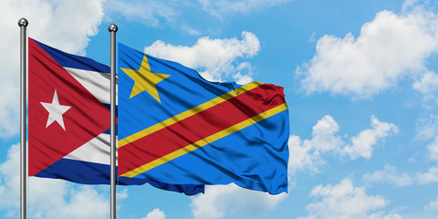 Cuba and Congo flag waving in the wind against white cloudy blue sky together. Diplomacy concept, international relations.