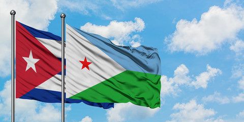 Cuba and Djibouti flag waving in the wind against white cloudy blue sky together. Diplomacy concept, international relations.