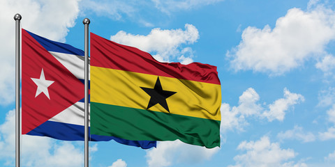 Cuba and Ghana flag waving in the wind against white cloudy blue sky together. Diplomacy concept, international relations.