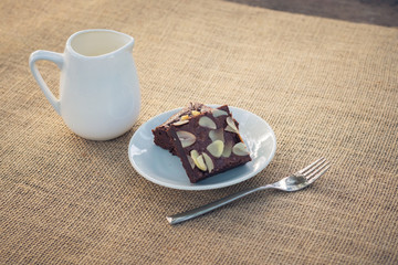 Fudge brownies in white dish on table
