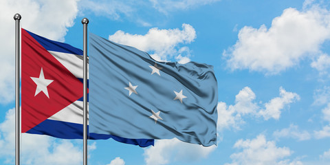 Cuba and Micronesia flag waving in the wind against white cloudy blue sky together. Diplomacy concept, international relations.