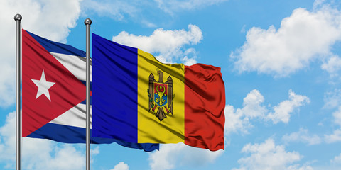 Cuba and Moldova flag waving in the wind against white cloudy blue sky together. Diplomacy concept, international relations.