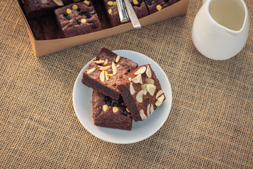 Fudge brownies in white dish on table and top view