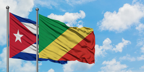 Cuba and Republic Of The Congo flag waving in the wind against white cloudy blue sky together. Diplomacy concept, international relations.