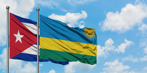 Cuba and Rwanda flag waving in the wind against white cloudy blue sky together. Diplomacy concept, international relations.