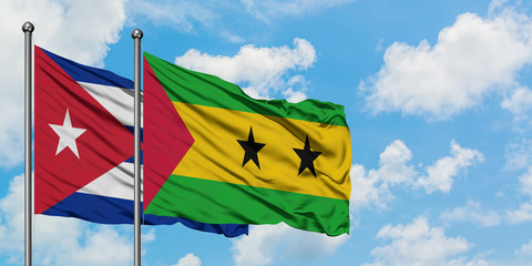 Cuba and Sao Tome And Principe flag waving in the wind against white cloudy blue sky together. Diplomacy concept, international relations.