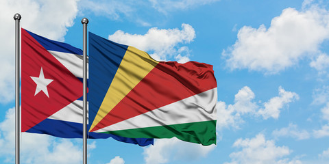 Cuba and Seychelles flag waving in the wind against white cloudy blue sky together. Diplomacy concept, international relations.