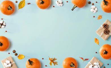 Autumn theme with orange pumpkins - flat lay