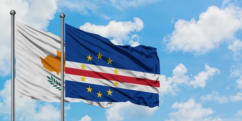 Cyprus and Cape Verde flag waving in the wind against white cloudy blue sky together. Diplomacy concept, international relations.