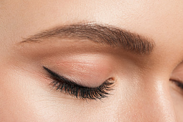 Obraz premium Young woman with beautiful eyebrows, closeup