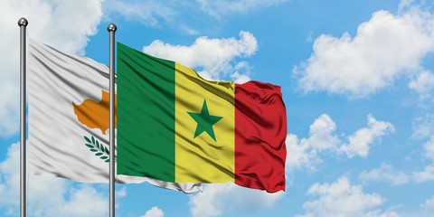 Cyprus and Senegal flag waving in the wind against white cloudy blue sky together. Diplomacy concept, international relations.