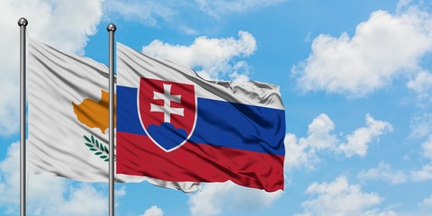 Cyprus and Slovakia flag waving in the wind against white cloudy blue sky together. Diplomacy concept, international relations.