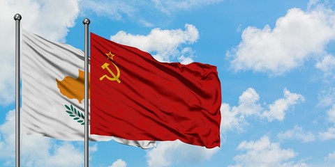 Cyprus and Soviet Union flag waving in the wind against white cloudy blue sky together. Diplomacy concept, international relations.