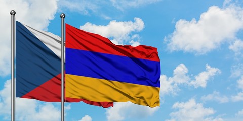 Czech Republic and Armenia flag waving in the wind against white cloudy blue sky together. Diplomacy concept, international relations.