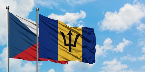 Czech Republic and Barbados flag waving in the wind against white cloudy blue sky together. Diplomacy concept, international relations.