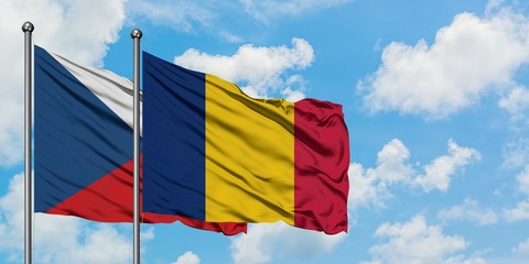 Czech Republic and Chad flag waving in the wind against white cloudy blue sky together. Diplomacy concept, international relations.