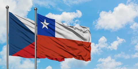 Czech Republic and Chile flag waving in the wind against white cloudy blue sky together. Diplomacy concept, international relations.