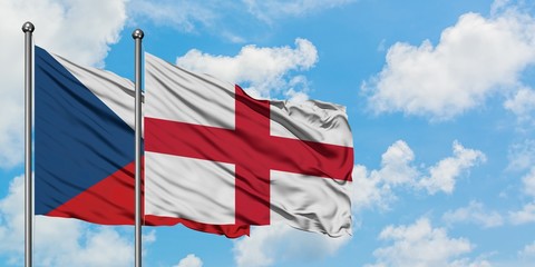 Czech Republic and England flag waving in the wind against white cloudy blue sky together. Diplomacy concept, international relations.