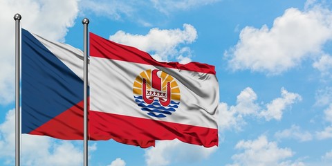 Czech Republic and French Polynesia flag waving in the wind against white cloudy blue sky together. Diplomacy concept, international relations.