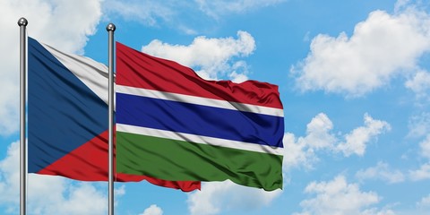 Czech Republic and Gambia flag waving in the wind against white cloudy blue sky together. Diplomacy concept, international relations.