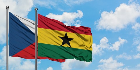 Czech Republic and Ghana flag waving in the wind against white cloudy blue sky together. Diplomacy concept, international relations.