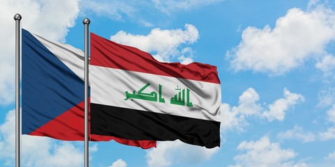 Czech Republic and Iraq flag waving in the wind against white cloudy blue sky together. Diplomacy concept, international relations.