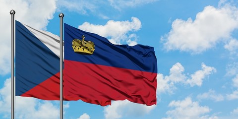 Czech Republic and Liechtenstein flag waving in the wind against white cloudy blue sky together. Diplomacy concept, international relations.