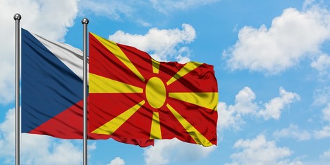 Czech Republic and Macedonia flag waving in the wind against white cloudy blue sky together. Diplomacy concept, international relations.