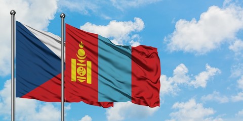 Czech Republic and Mongolia flag waving in the wind against white cloudy blue sky together. Diplomacy concept, international relations.