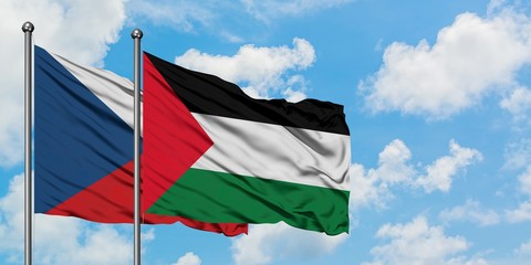 Czech Republic and Palestine flag waving in the wind against white cloudy blue sky together. Diplomacy concept, international relations.