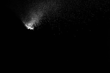 Fototapeta na wymiar abstract white dust explosion on a black background.