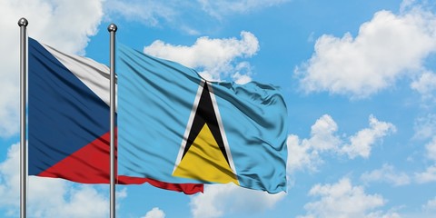 Czech Republic and Saint Lucia flag waving in the wind against white cloudy blue sky together. Diplomacy concept, international relations.