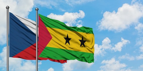 Czech Republic and Sao Tome And Principe flag waving in the wind against white cloudy blue sky together. Diplomacy concept, international relations.
