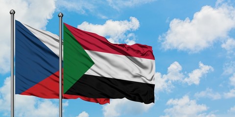 Czech Republic and Sudan flag waving in the wind against white cloudy blue sky together. Diplomacy concept, international relations.