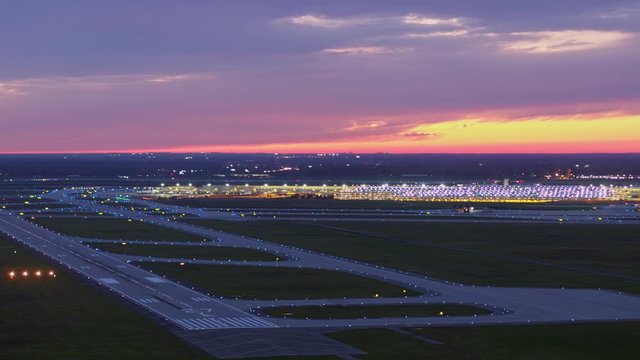Detroit Michigan Aerial v171 Panning sunset dusk airport view with landing and take off action - October 2017