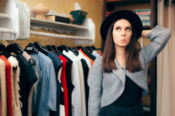 Naklejka na ściany i meble Fashionable Woman in Clothing Store with Fedora Hat