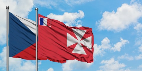 Czech Republic and Wallis And Futuna flag waving in the wind against white cloudy blue sky...