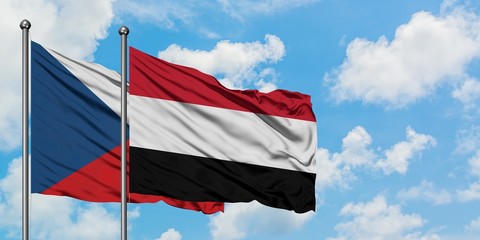 Czech Republic and Yemen flag waving in the wind against white cloudy blue sky together. Diplomacy concept, international relations.