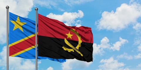 Congo and Angola flag waving in the wind against white cloudy blue sky together. Diplomacy concept, international relations.