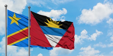 Congo and Antigua and Barbuda flag waving in the wind against white cloudy blue sky together. Diplomacy concept, international relations.