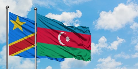Congo and Azerbaijan flag waving in the wind against white cloudy blue sky together. Diplomacy concept, international relations.