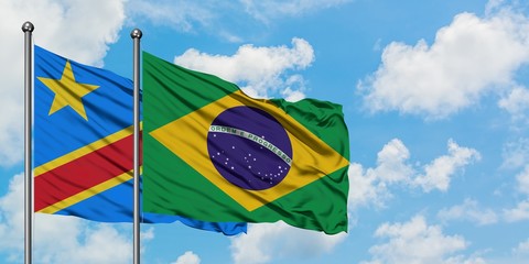 Congo and Brazil flag waving in the wind against white cloudy blue sky together. Diplomacy concept, international relations.