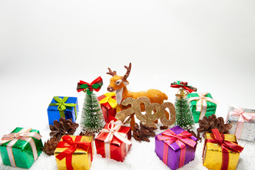 Fototapeta na wymiar Christmas holiday theme with reindeer and Christmas trees