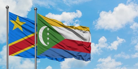 Congo and Comoros flag waving in the wind against white cloudy blue sky together. Diplomacy concept, international relations.