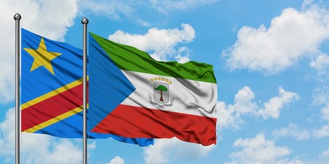 Congo and Equatorial Guinea flag waving in the wind against white cloudy blue sky together. Diplomacy concept, international relations.